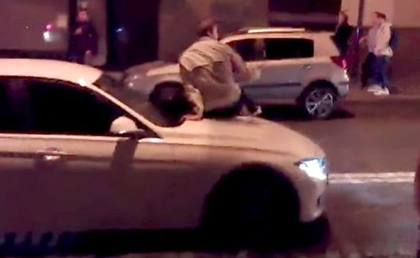 В Харькове водитель BMW прокатил на капоте пешехода